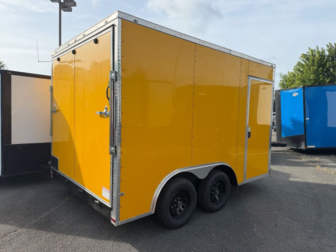2026 Maximum 8.5x12 enclosed cargo trailer in yellow, photo 8