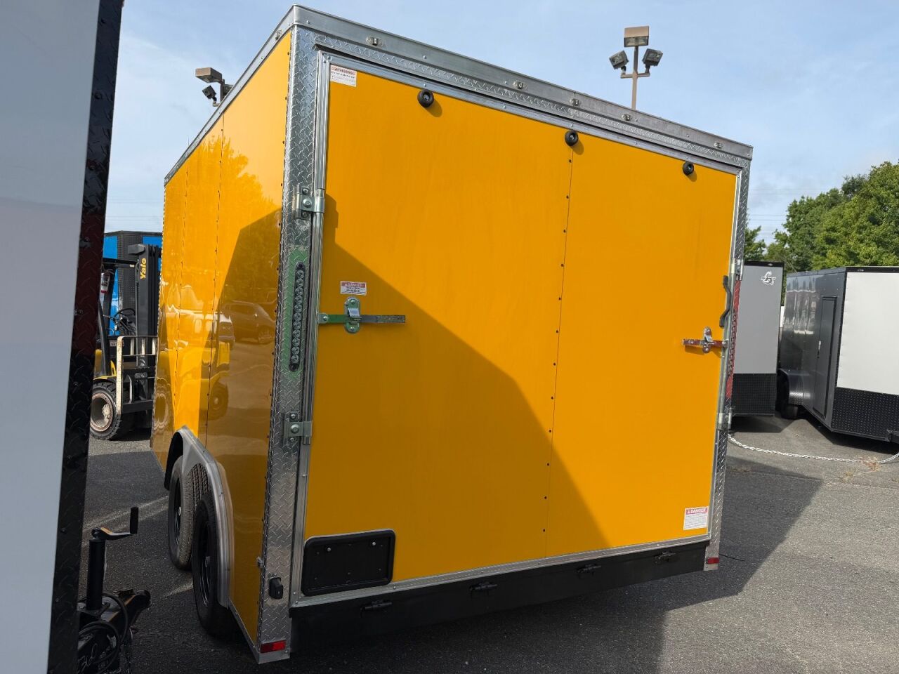 2026 Maximum 8.5x12 enclosed cargo trailer in yellow, photo 2